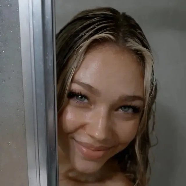 Kenzie at the motel shower door